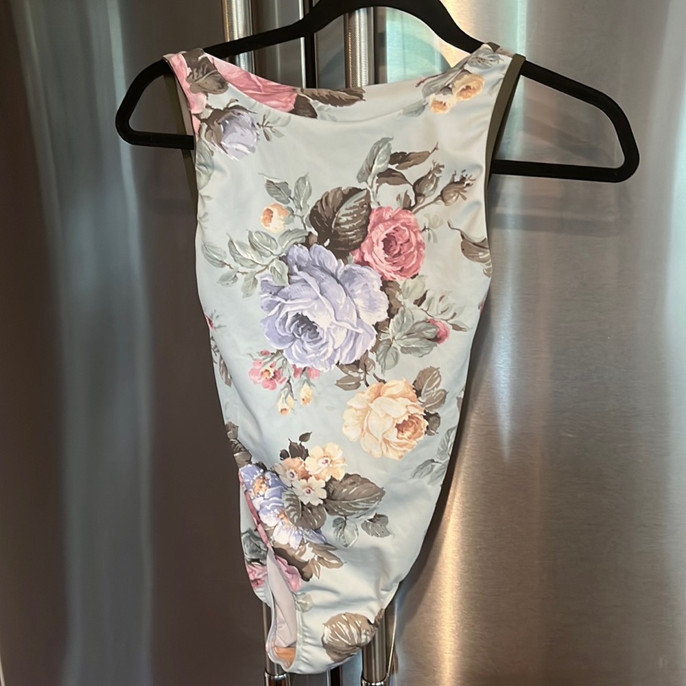 Eleve leo.  Floral with dark olive trim and mesh with open back.